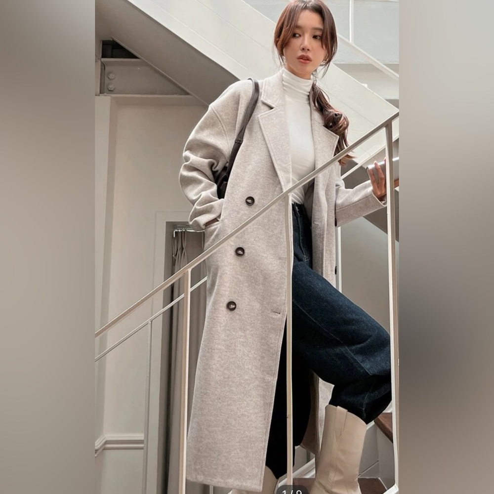 Tan double breasted overcoat. Runs a bit large for me. Brand new never worn.